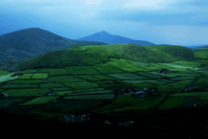 Text: Best time to visit Dingle for stunning summer views