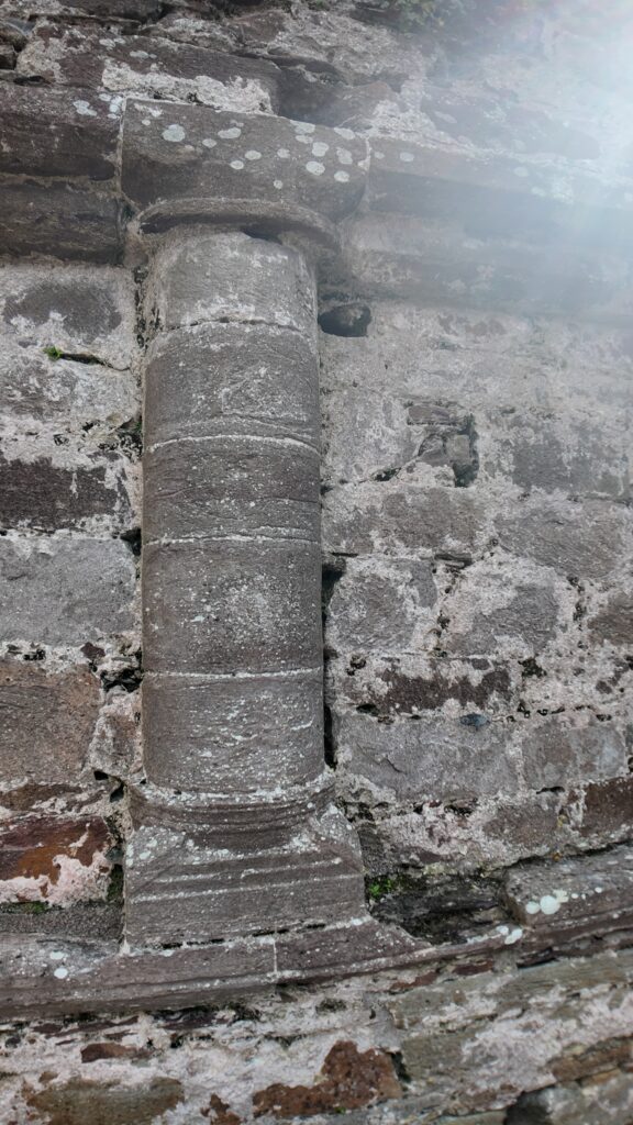 Close-up of a Romanesque doorway column at Kilmalkedar Church showing finely dressed medieval stonework in County Kerry.