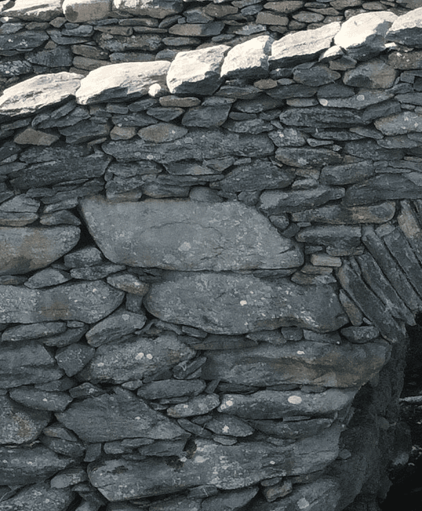 Close-up of the dry-laid stone masonry forming the side wall of Garfinny Bridge in County Kerry.