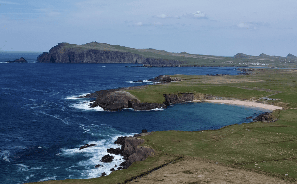 Rocky Atlantic coastline, sheltered coves and green headlands along Slea Head on the western Dingle Peninsula.