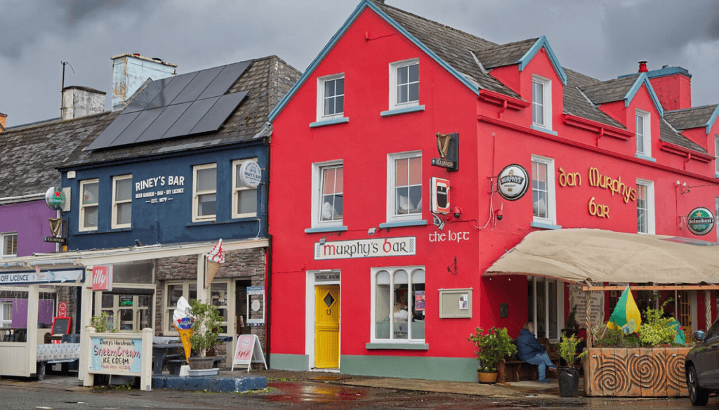 Colourful pub fronts in Sneem village, County Kerry, including Riney’s Bar and Dan Murphy’s Bar.