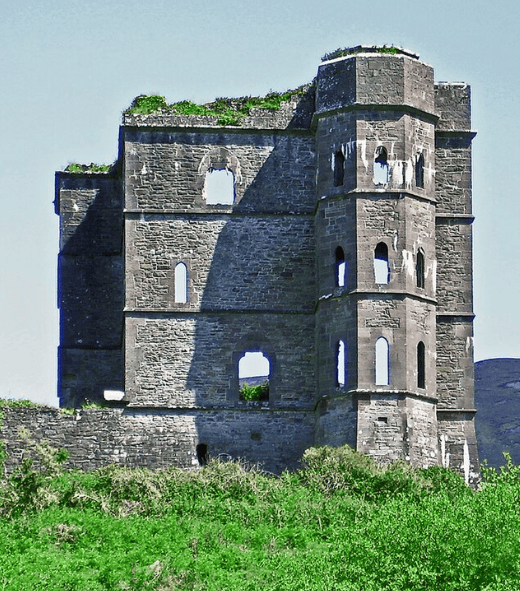 Ruins of Glenbeigh Towers, also known as Wynn’s Folly, with its tall stone walls and projecting tower against the Kerry landscape.