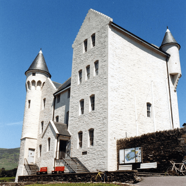 Cahersiveen Heritage Centre in the former Royal Irish Constabulary barracks, with white stone walls and distinctive corner towers.