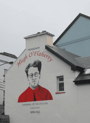 Mural of Monsignor Hugh O’Flaherty in Cahersiveen, depicting the Kerry-born priest known for his humanitarian work in wartime Rome.