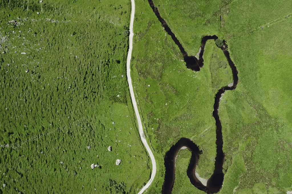Winding upland stream and narrow track near Annascaul Lake.